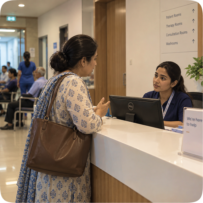 A family member at the reception desk, talking to a staff member